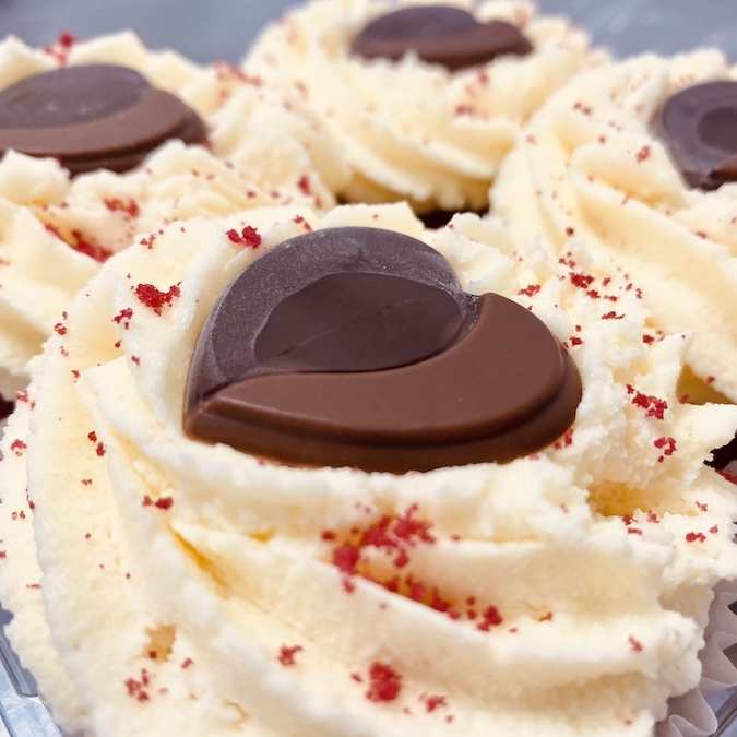 Red Velvet Valentines Cupcakes with chocolate hearts on top